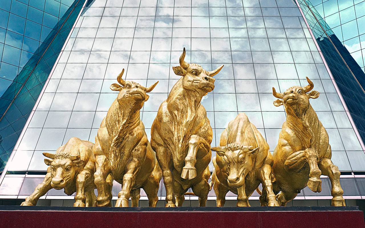 The five golden bull statues in front of the Citic Pent-Ox Metropolis Business Hotel in Shanghai, China.