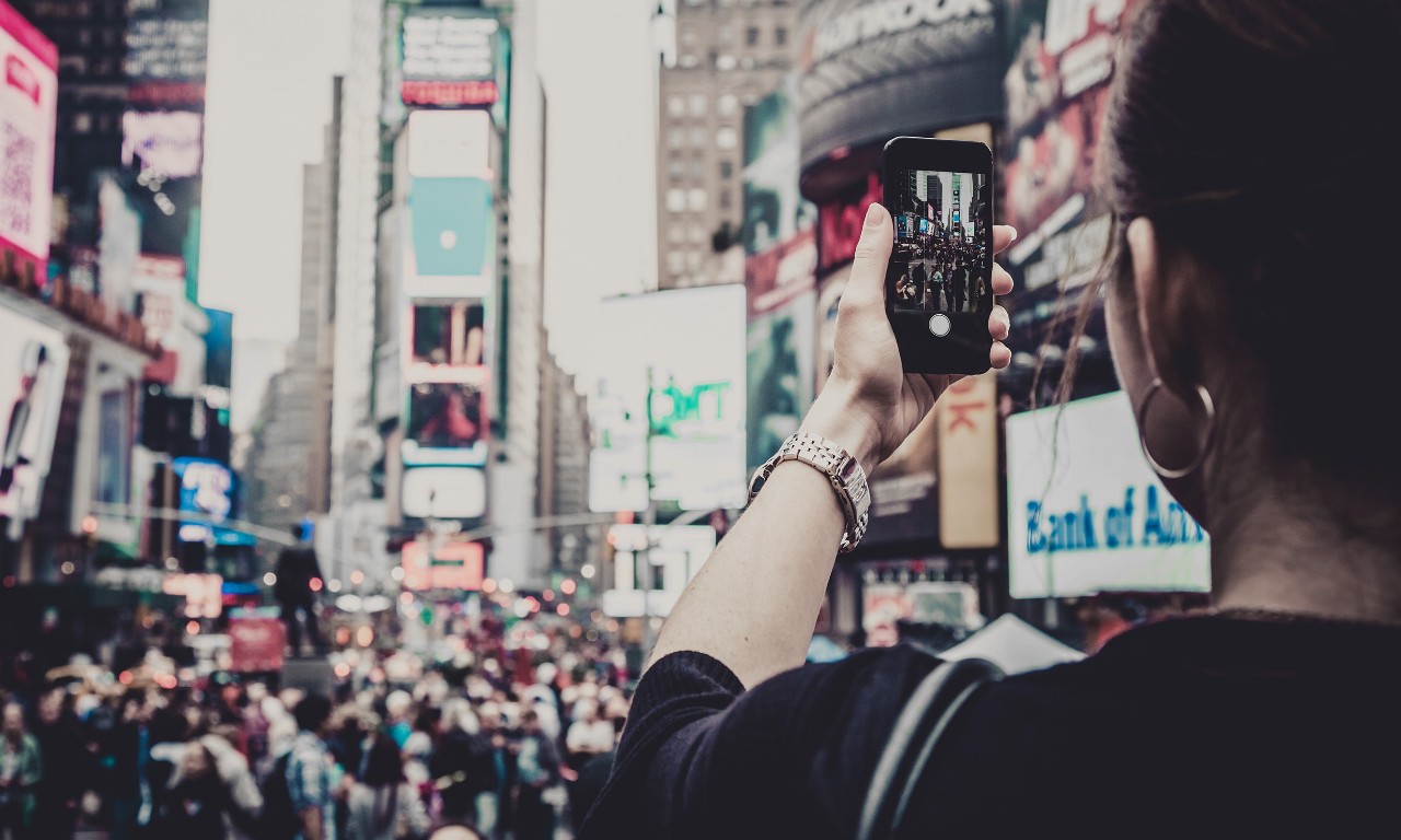 Woman Taking Picture With Mobile Phone at Times Squares, New York