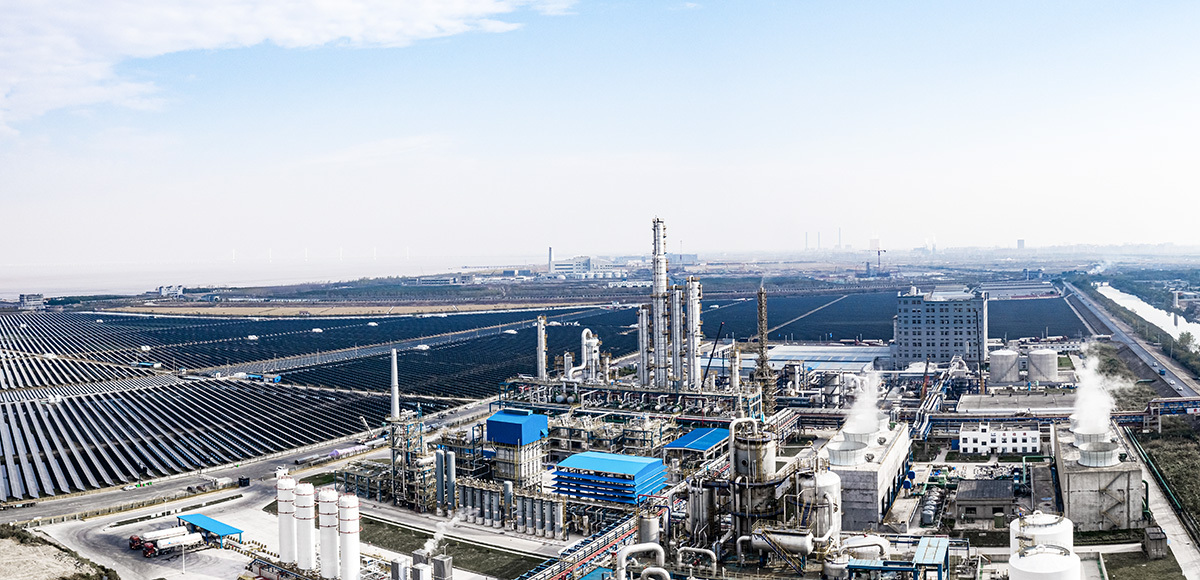 Aerial view of the symbiosis of solar power plants and chemical plants