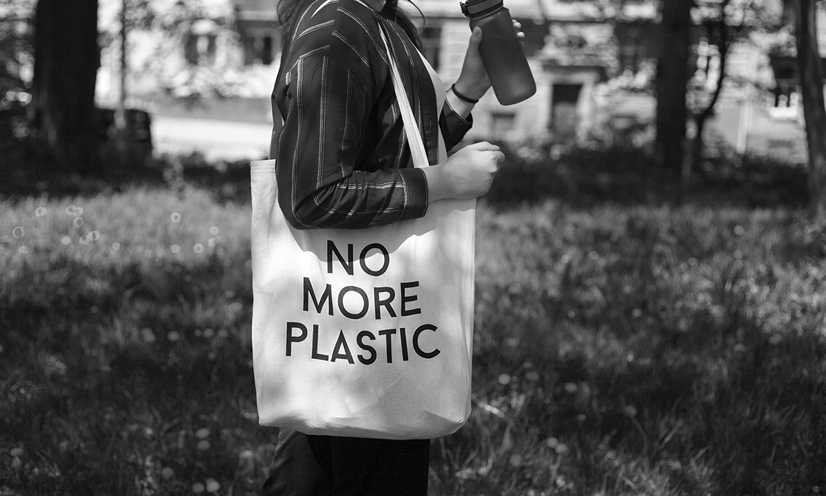 Glass-walled building reflecting trees. This is shoot with a composition to look up from a lower place.