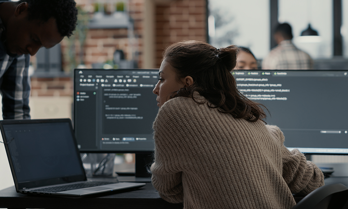 rear view of young woman looking away while sitting in cafe