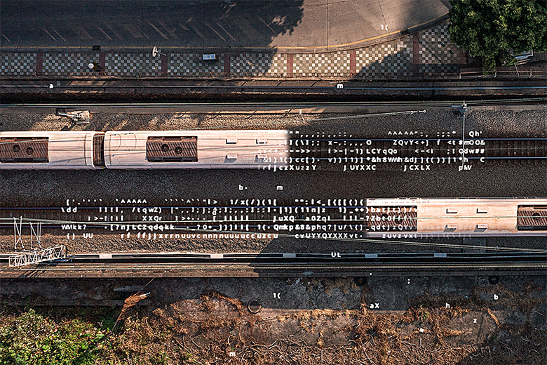 Aerial view of a passenger train with AI data overlays highlighting AI in rail transportation and logistics infrastructure.