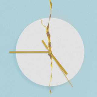 A broken clock face against a pale blue background