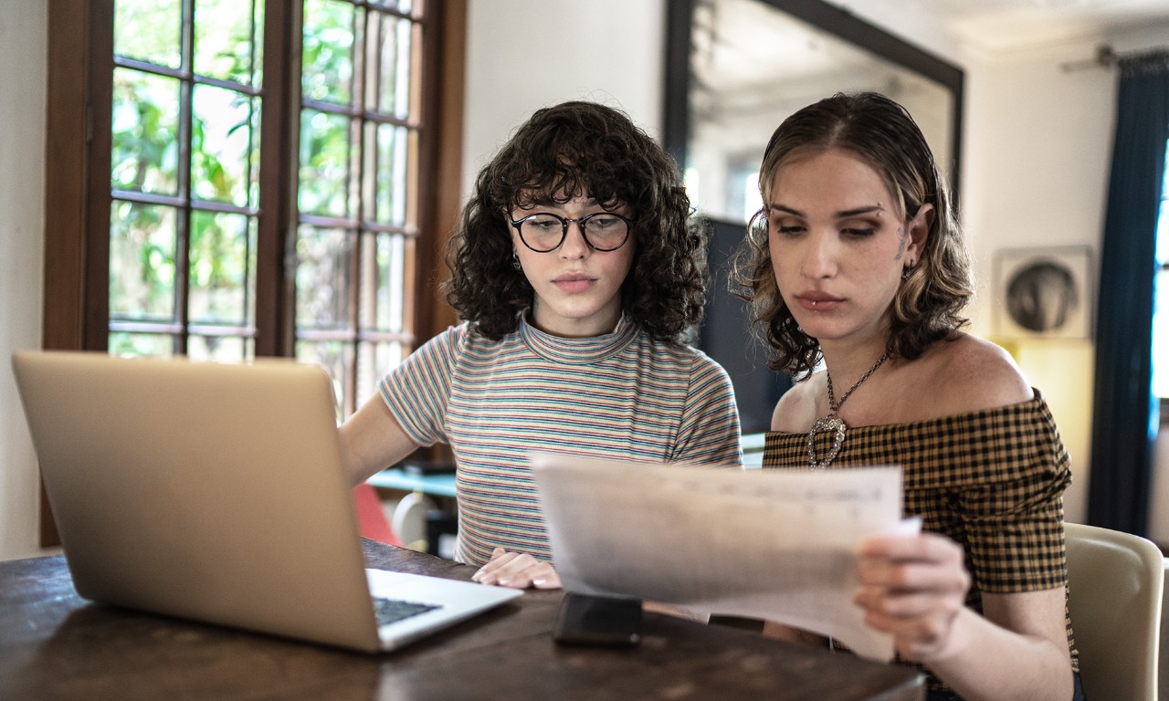 Transgender women doing home finances together at home