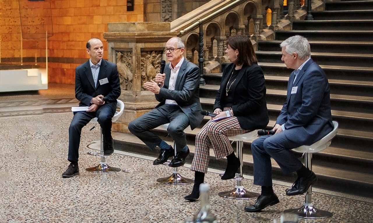 Sir Patrick Vallance makes a point about wielding influence alongside fellow panelists Baroness Nicky Morgan and Damian Reece, with moderator Davide Taliente (left).