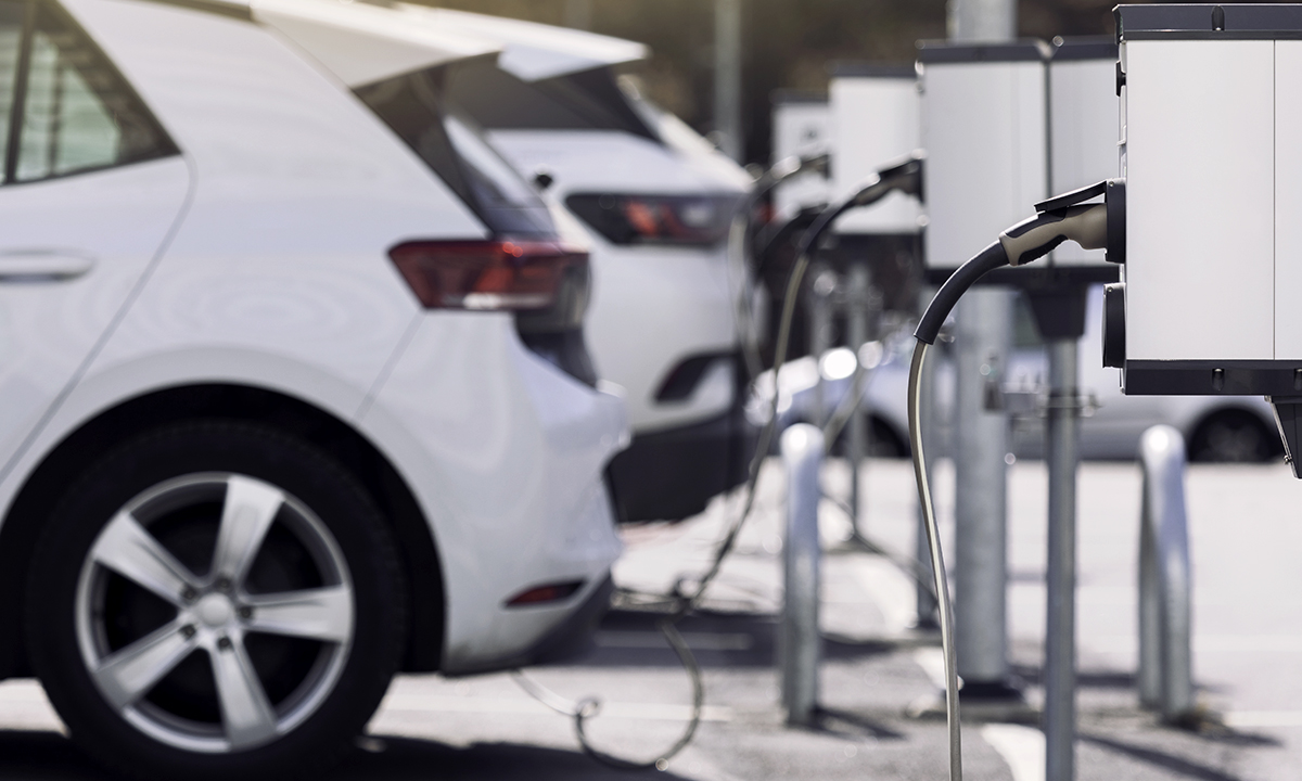 A parking lot with charging stations for electric cars.