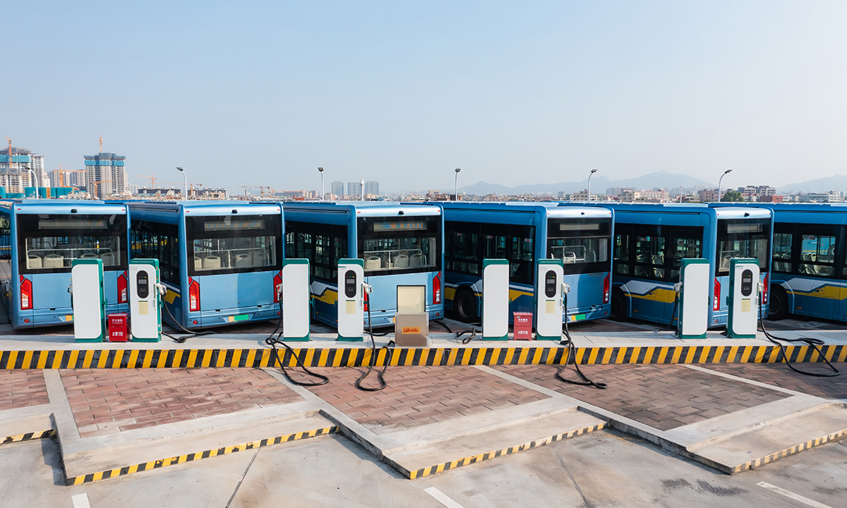 An electric bus fleet at a charging station.